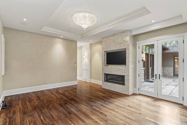 Room with fireplace and French doors